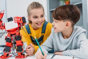 stock-photo-happy-classmates-talking-stem-robotics
